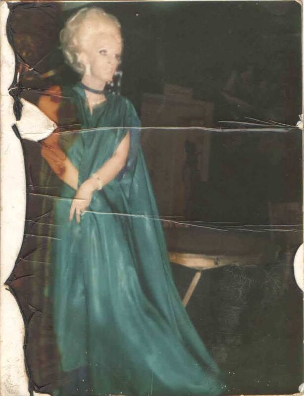 Miss P at Parliament House, Orlando. The image is from a polaroid, damage on left side where it was cut from the chemical backing. 

Images contributed by the estate of the Wegman Family