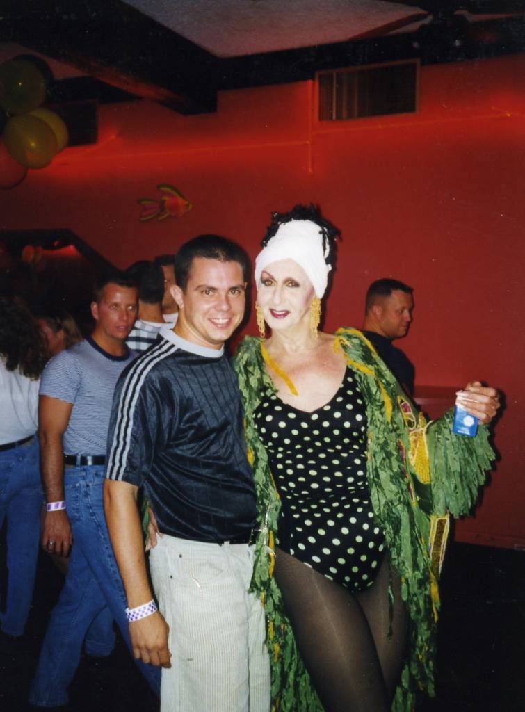 Miss P with audience at Parliament House, Orlando. Written on back of the image "October 3, 1997 Yes, that's a towel on my head". Miss P's famous one eyebrow look began around the mid to late 1990's.

Images may be used for educational purposes only.
Image credit: Image courtesy of LGBTQ History Museum of Central Florida.
For all other purposes please email: floridalgbtqmuseum@gmail.com