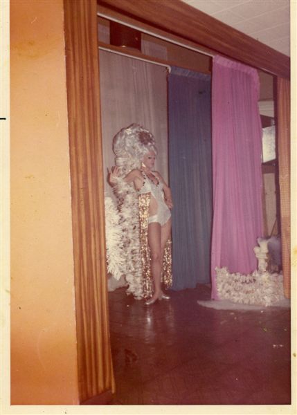 Miss P performing at The Horny Bull, Tampa in 1971. The Horny Bull was one of Tampa's first drag bar where many performers got their start in drag performance. Dave Wegman, his brother, comments that image was taken in "1972 at The Horny Bull in Tampa. He detailed on this costume and number in the James Sears book 'Rebels, Rubyfruit, and Rhinestones'. The song was "I Capricorn" by Shirley Bassey."

For all other purposes please email: floridalgbtqmuseum@gmail.com