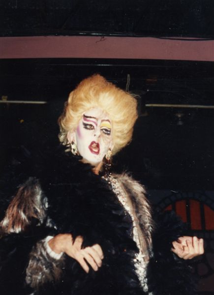 "Miss P performing on the Footlight Theatre at Parliament House on Halloween" (1980s)

Images may be used for educational purposes only.
Image credit: Image courtesy of LGBTQ History Museum of Central Florida.
For all other purposes please email: floridalgbtqmuseum@gmail.com