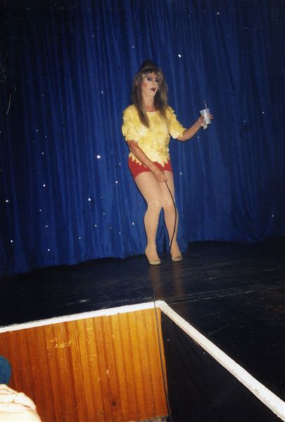  Miss P performing her iconic "Here's Pussy" routine in the Footlight Theatre at Parliament House, Orlando.

Images may be used for educational purposes only.
Image credit: Image courtesy of LGBTQ History Museum of Central Florida.
For all other purposes please email: floridalgbtqmuseum@gmail.com